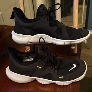 Nike Kids Black and White Sneakers with Yellow Accent